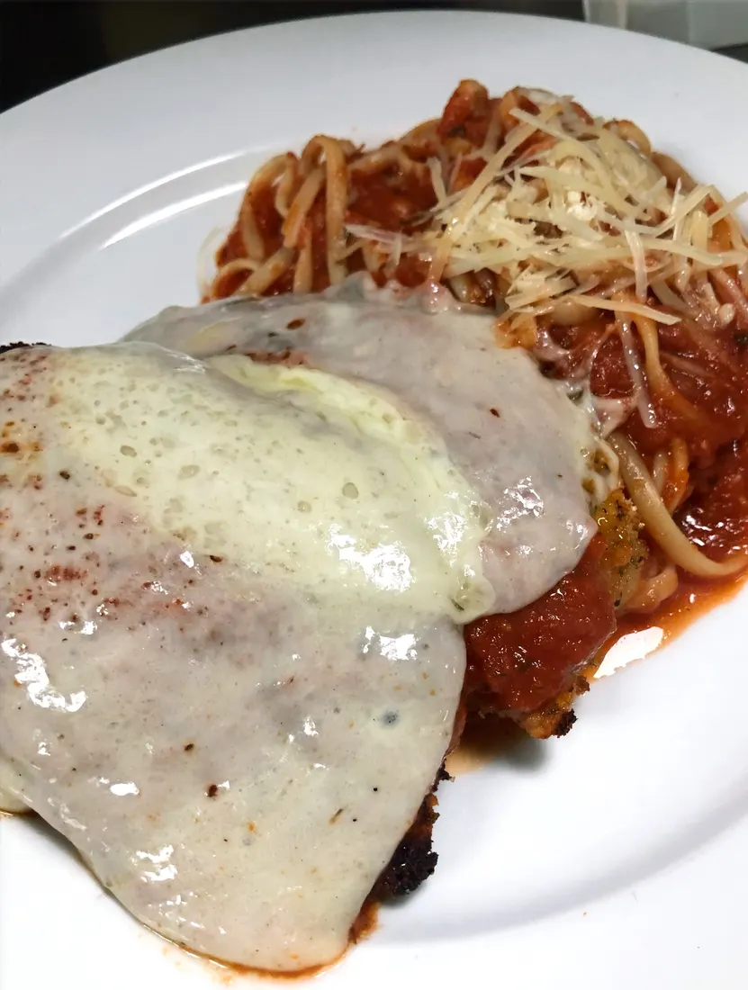 Chicken parmesan with linguini marinara