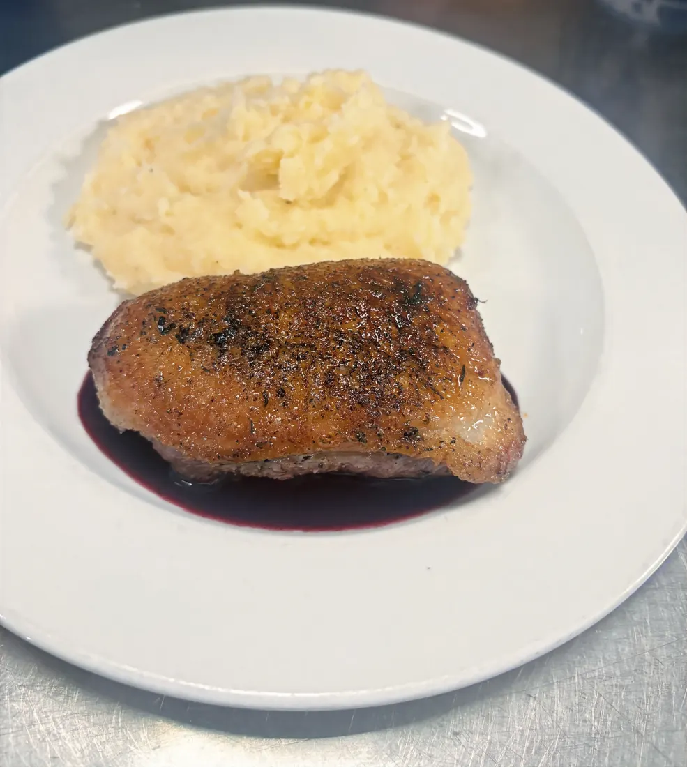 Duck breast over blackberry gin reduction