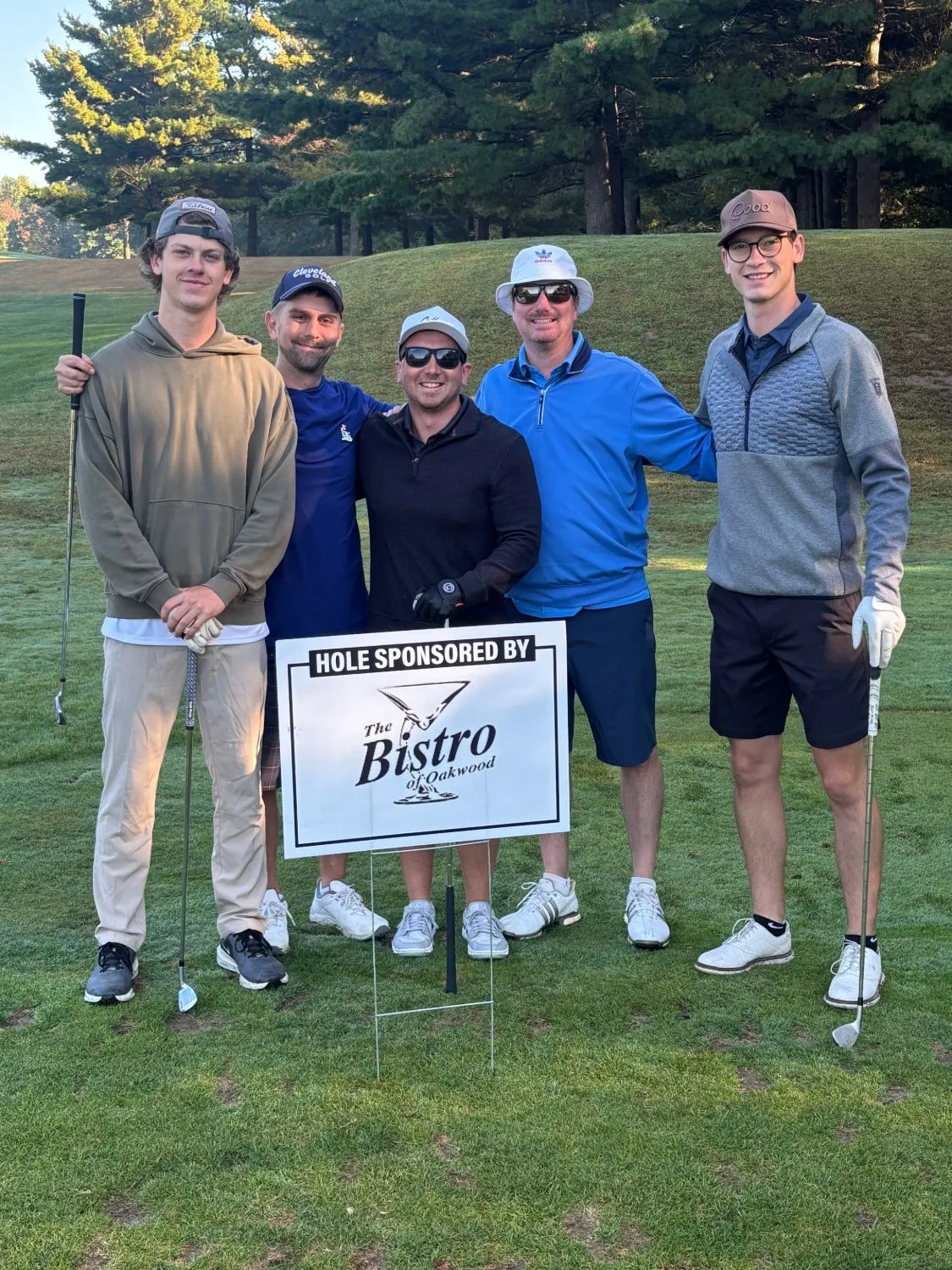 Tony, head of kitchen Tristan and friends at a golf hole sponsored by The Bistro of Oakwood